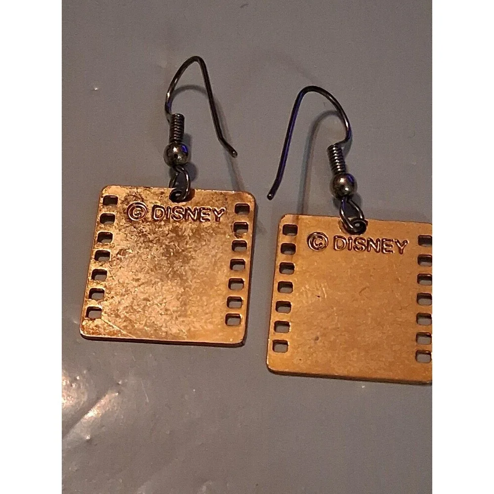 Disney Mickey Mouse gold-tone filmstrip dangle earrings featuring a smiling...